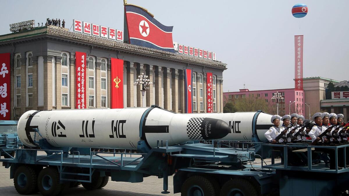Submarine missiles are taken across Kim Il Sung Square during a military parade in Pyongyang, North Korea, on Saturday.
