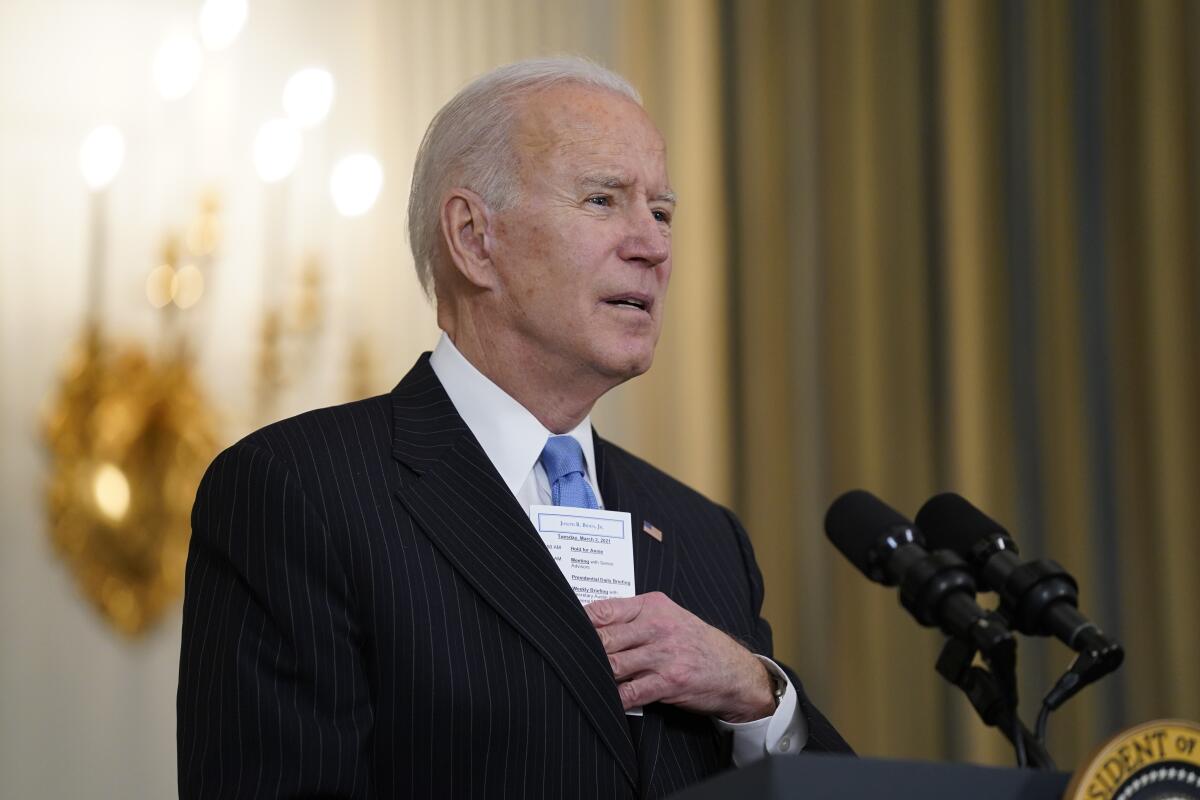 President Joe Biden speaks about efforts to combat COVID-19, in the State Dining Room of the White House.
