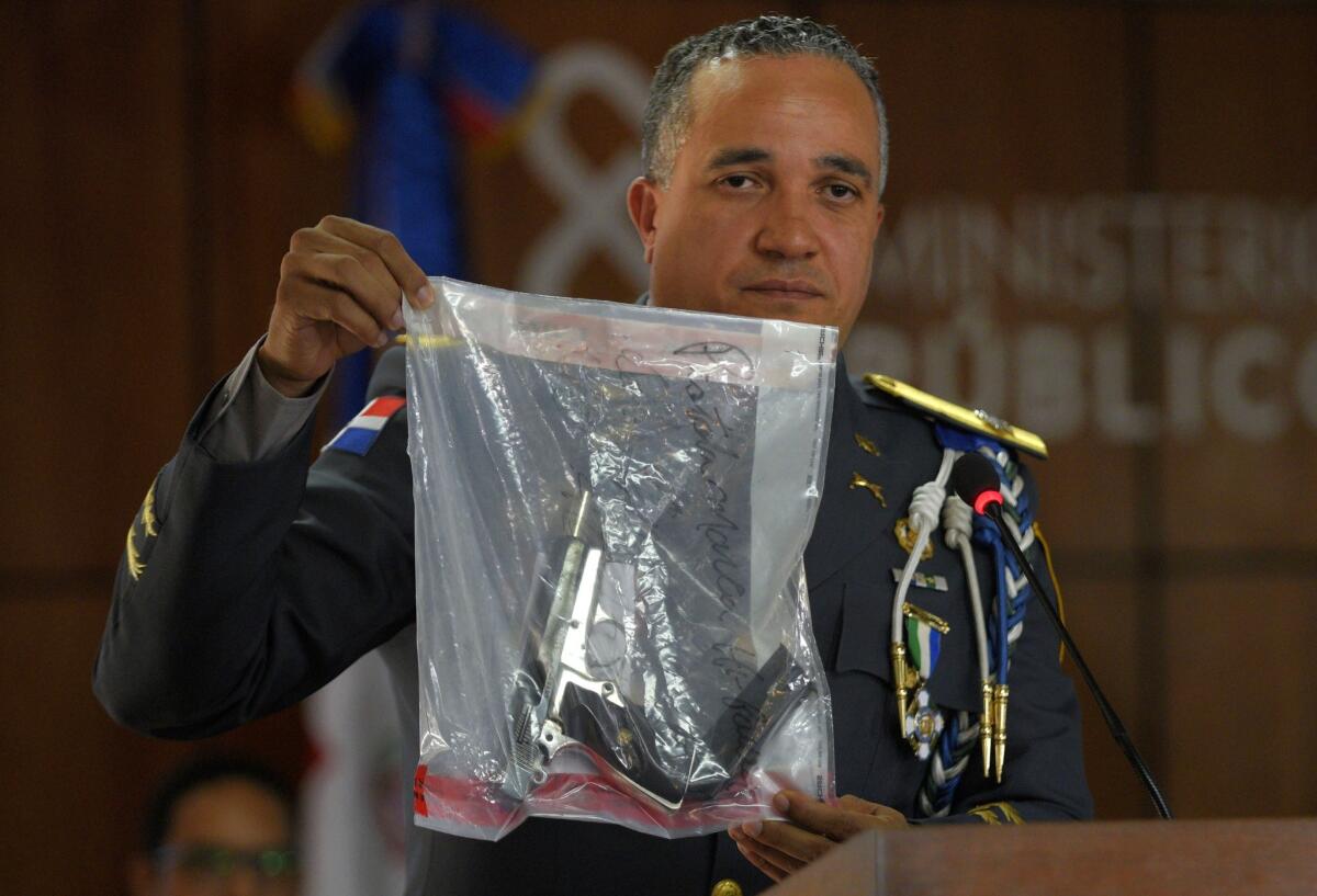 General Ney Aldrin Bautista Almonte, director of the Dominican Republic national police, shows the gun that was used to shoot former Boston Red Sox slugger David Ortiz.