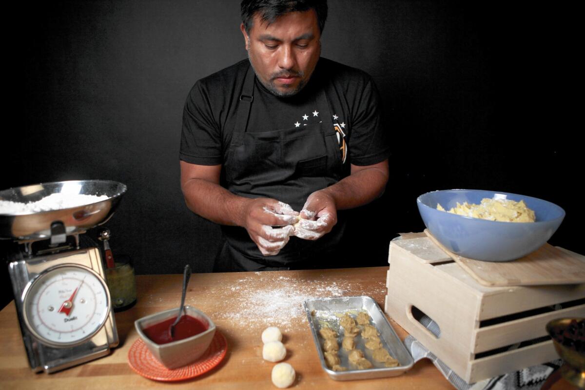 Chef and cookbook author Ricardo Zarate prepares his foie gras churros, which will be fried and dusted with sugar.