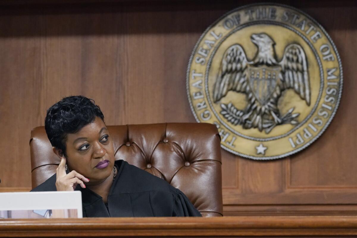 FILE - Hinds County Chancery Judge Crystal Wise Martin listens as lawyer Rob McDuff, attorney for Parents For Public Schools, presents arguments in a lawsuit that says the state violates its own constitution with a grant program for private schools, during a hearing in Jackson, Miss., Aug. 23, 2022. Judge Martin on Thursday, Oct. 13, 2022, blocked a state law that put $10 million of federal pandemic relief money into infrastructure grants for private schools. (AP Photo/Rogelio V. Solis, File)