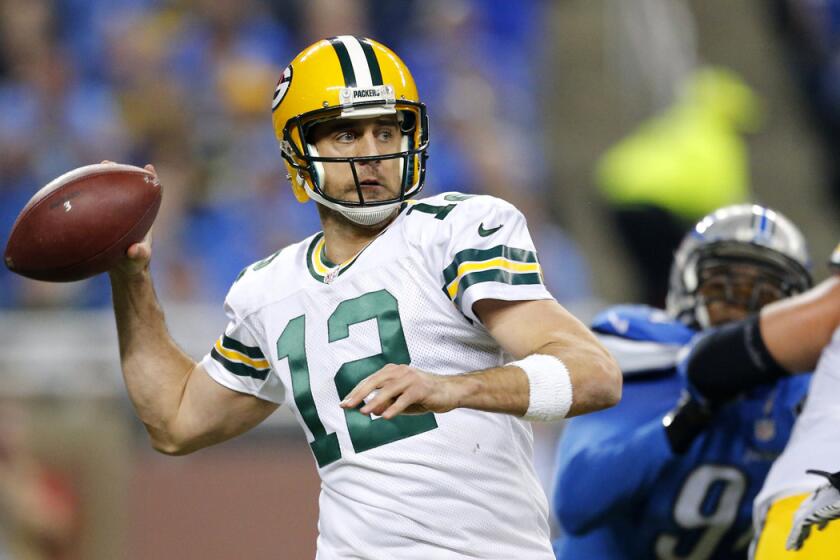 Green Bay Packers quarterback Aaron Rodgers throws during the second half against the Detroit Lions on Thursday.