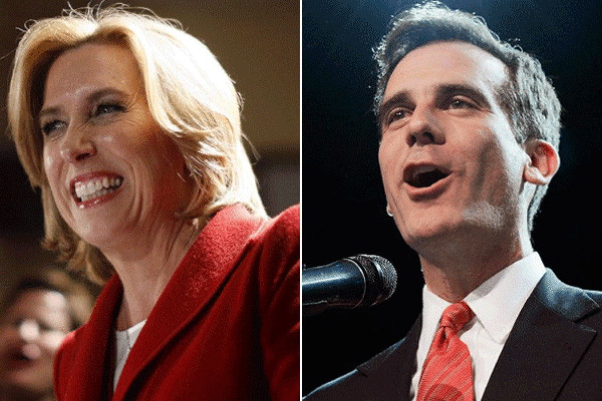 Mayoral candidates Wendy Greuel and Eric Garcetti talk to their supporters on election night.