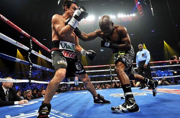 Timothy Bradley lands a right hand against Juan Manuel Marquez during their bout on Saturday night in Las Vegas.