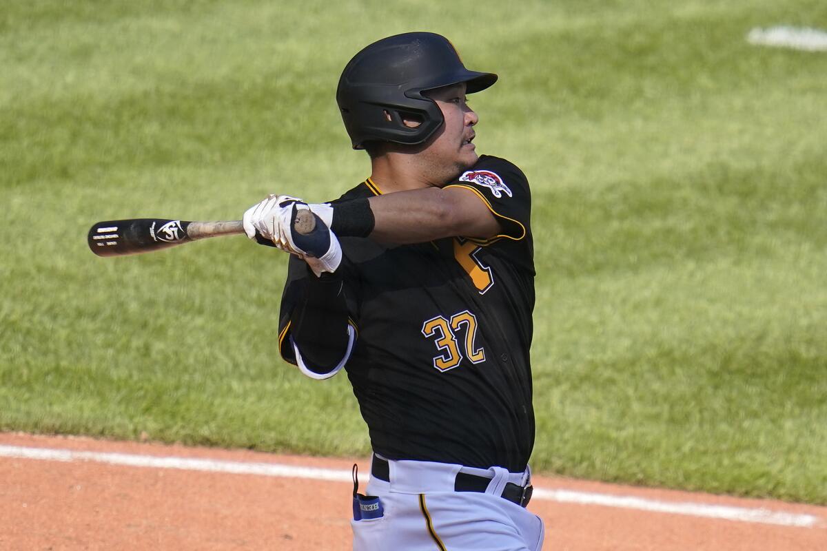 Pittsburgh Pirates' Yoshi Tsutsugo singles off Detroit Tigers relief pitcher Kyle Funkhouser, driving in two runs, during the seventh inning of a baseball game in Pittsburgh, Monday, Sept. 6, 2021. (AP Photo/Gene J. Puskar)