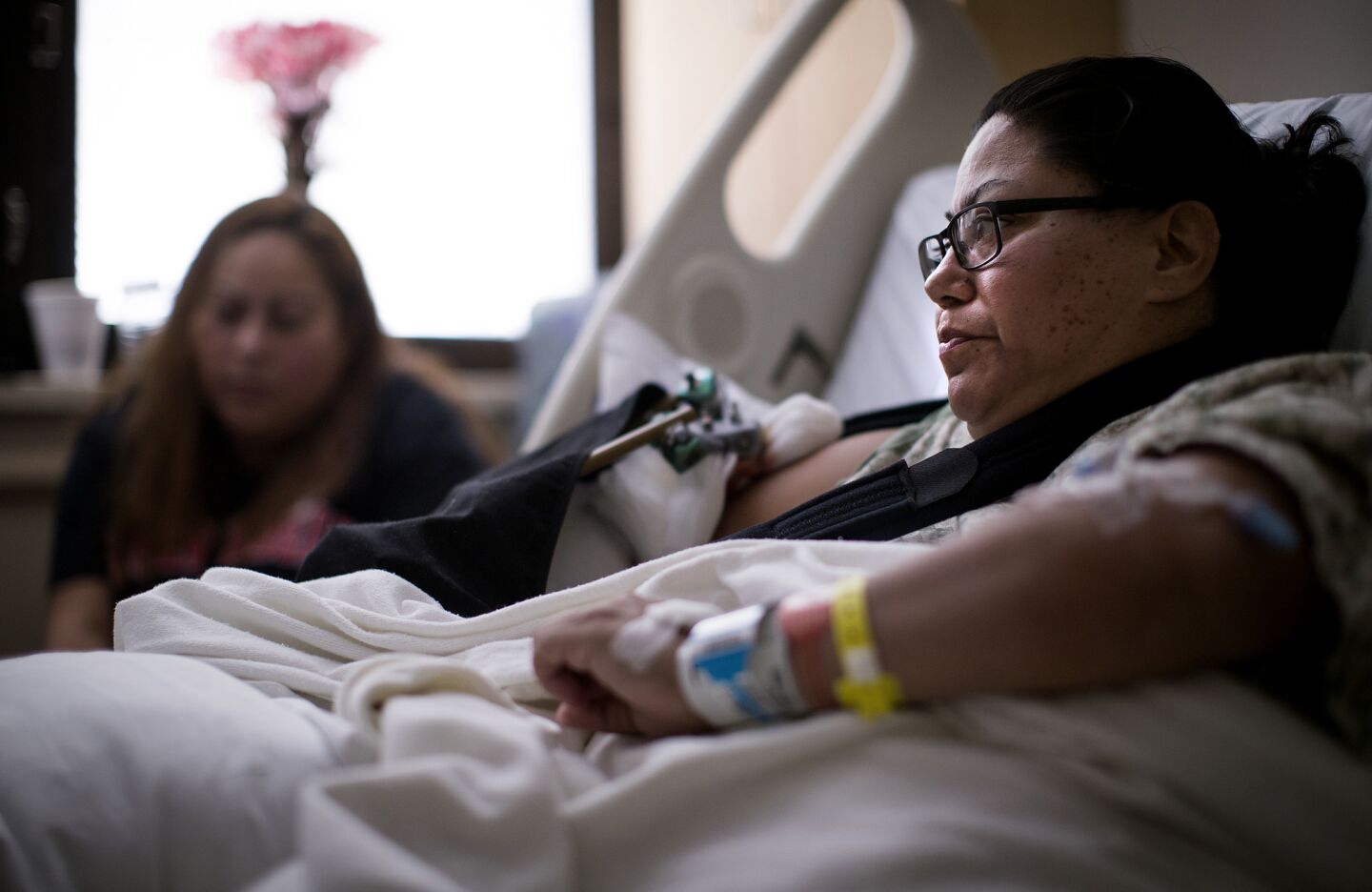 Shooting victim Paola Bautista, 39, right, of Fontana with her sister Daisy, 34, recounts her experience of running and hiding once they heard gunshots while attending the country music festival. Bautista was shot in the forearm and will require additional surgeries. She and her sister hid in a maintenance trailer for more than 3 hours.