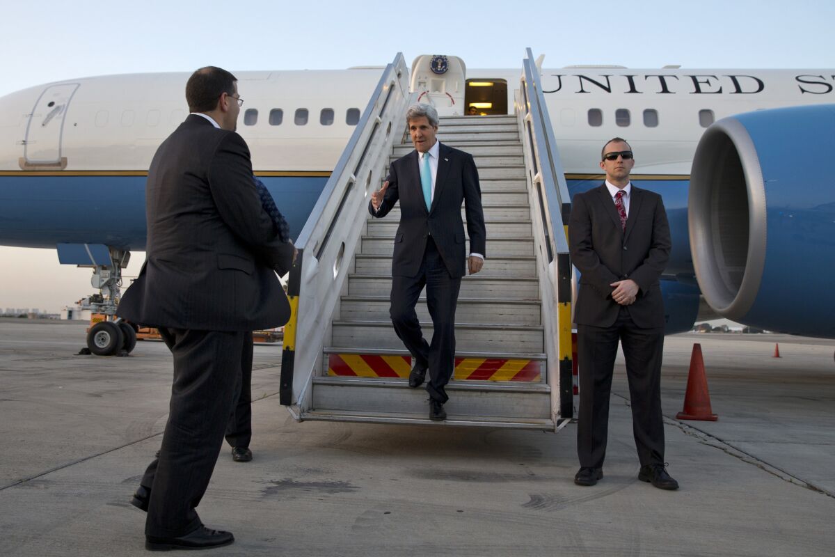U.S. Secretary of State John F. Kerry greets U.S. Ambassador Dan Shapiro as he arrives in Israel on his latest trip to try to salvage Mideast peace negotiations.