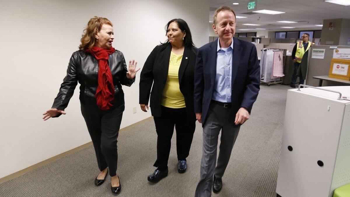 Los Angeles school Supt. Austin Beutner, right, with school board President Monica Garcia, met with Geri Guzman, left, and family members of students before holding a news conference.