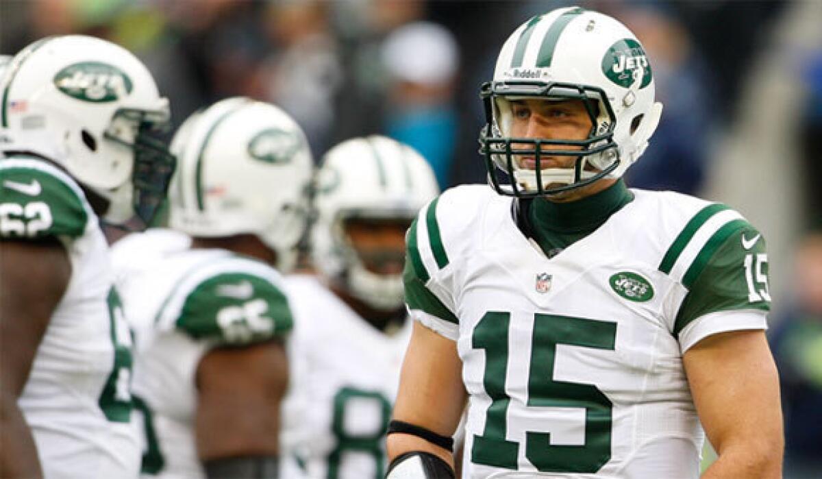 New York Jets quarterback Tim Tebow, right, is the target of some negative comments from anonymous teammates in an article run by the New York Daily News.