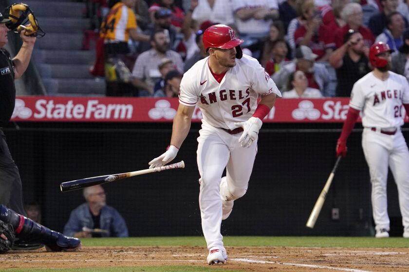 Los Angeles Angels' Mike Trout drops his bat as he hits a two-run home run during the third inning of a baseball game against the Cleveland Guardians Tuesday, April 26, 2022, in Anaheim, Calif. (AP Photo/Mark J. Terrill)
