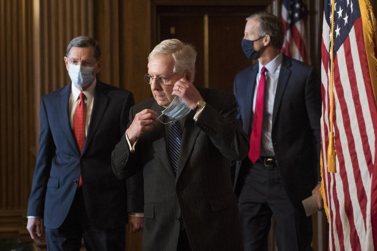 Sen. Mitch McConnell with Sens. John Barrasso, left, and John Thune.