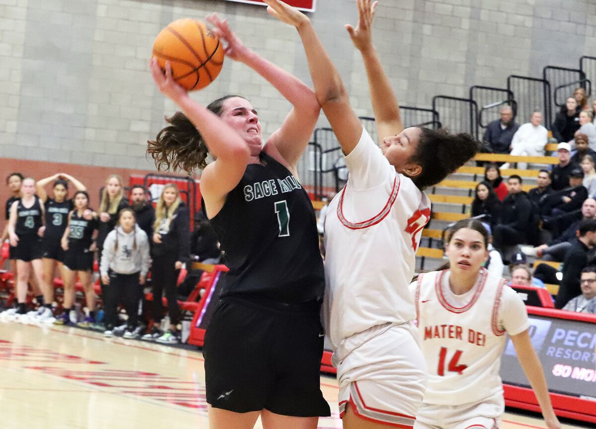 Sage Hill's Emily Eadie (1) drives to the basket against Mater Dei's Jenessa Cotton (42).