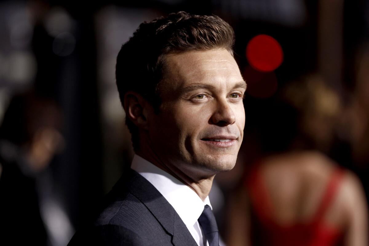 Ryan Seacrest arrives at the premiere of "New Year's Eve."