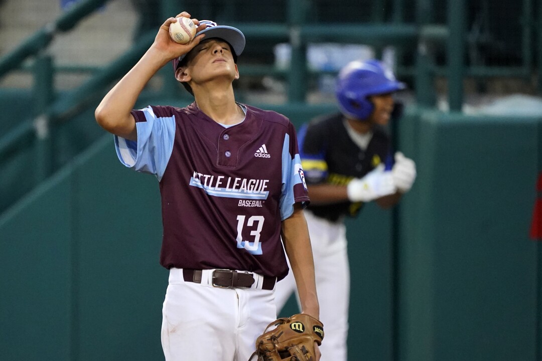 Hooksett, New Hampshire starting pitcher Mason DeVall (13) collects himself