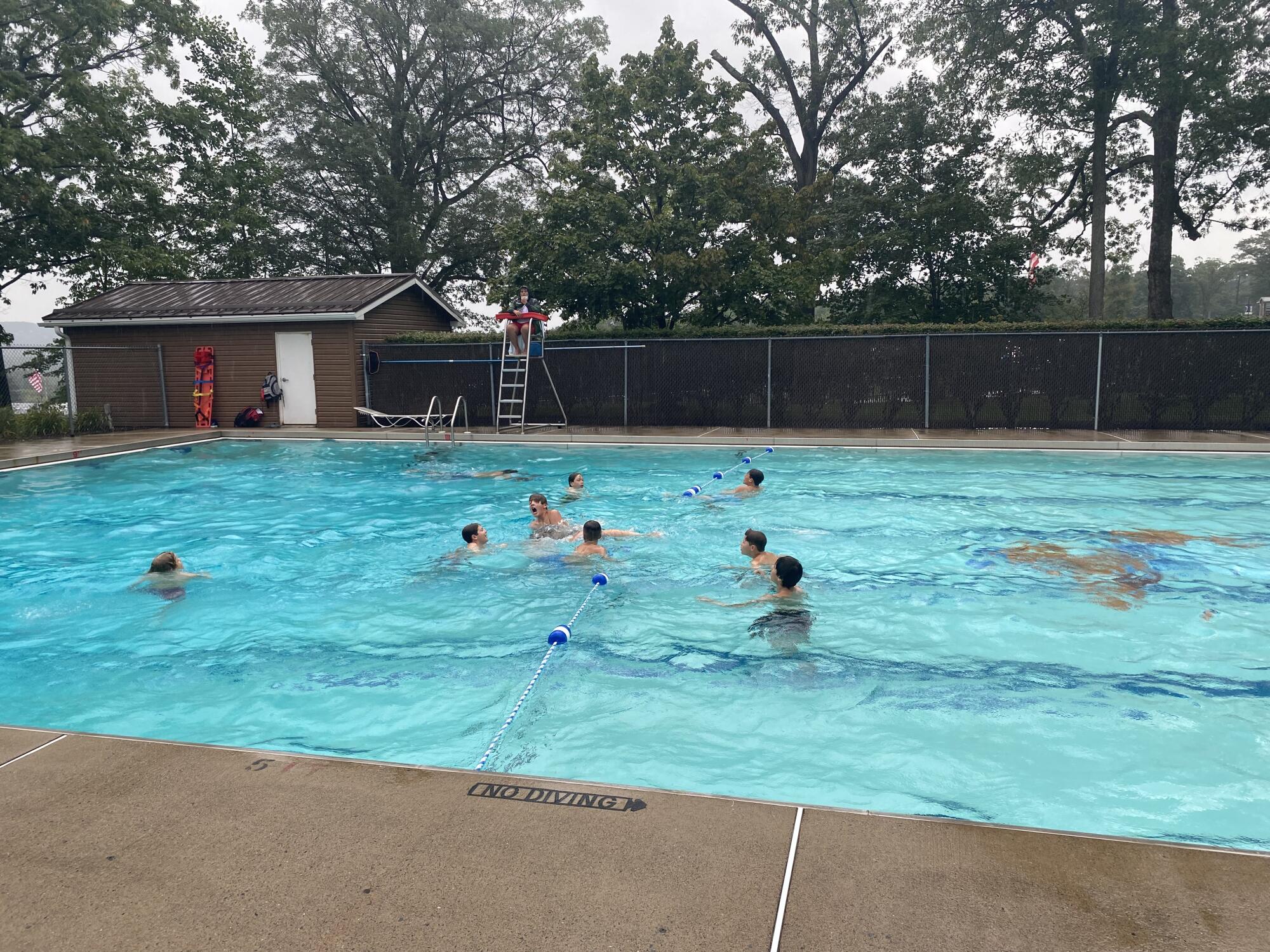 Wylie Little League take a break from practice by swimming at Little League headquarters complex.