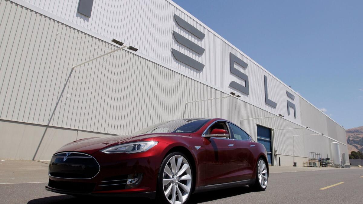 A Tesla Model S is shown outside the electric carmaker's factory in Fremont, Calif., in 2012.