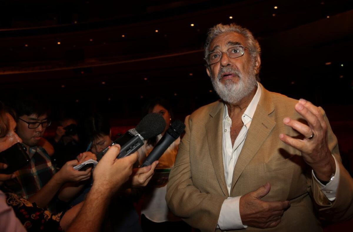 Placido Domingo talks to the press at the Dorothy Chandler Pavilion in 2013.