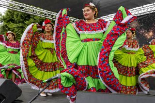 The ballet folklorico group, Nuevo Amanecer, takes the stage during the Fiestas Patrias Carnival held at the Anaheim Indoor Market Place on Saturday.