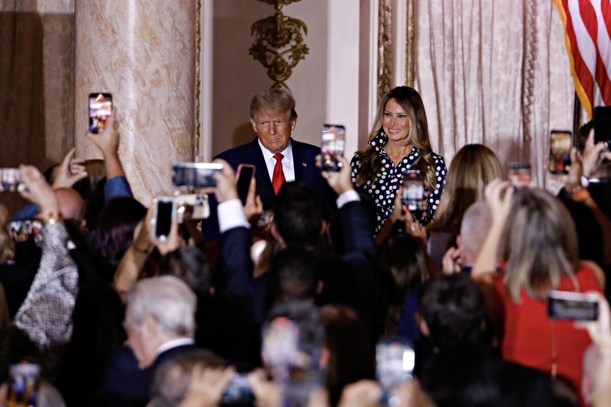 Donald Trump and Melania Trump arrive at the ex-president's 2024 campaign announcement in Palm Beach, Fla., on Nov. 15