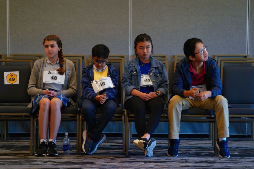 San Diego, CA - March 09: At the Countywide Spelling Bee on Thursday, March 9, 2023 in San Diego, CA., the final four, l-r, Marcella Steele, Mihir Konapaka, Kamryn Liu and Jedd Li sat before being called to the stage to compete. (Nelvin C. Cepeda / The San Diego Union-Tribune)