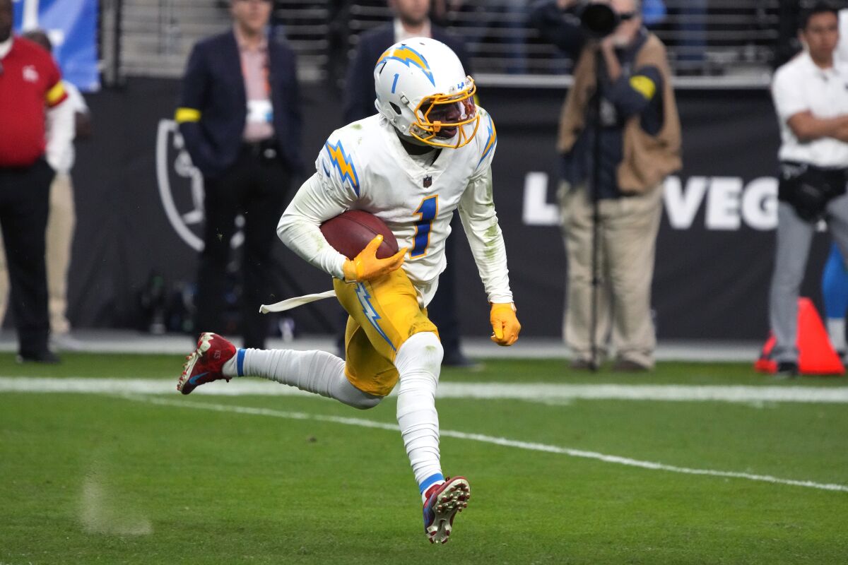 Chargers wide receiver DeAndre Carter runs the ball against the Las Vegas Raiders.
