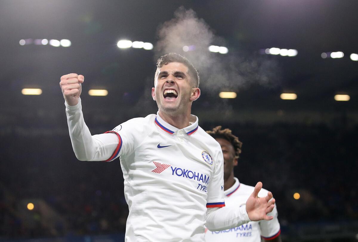 Christian Pulisic celebrates after scoring one of his three goals for Chelsea on Oct. 26, 2019, in Burnley.