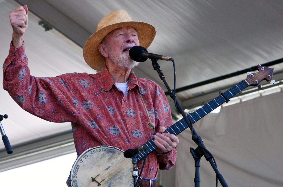 Folk singer and activist Pete Seeger, shown in 2009 at the New Orleans Jazz and Heritage Festival, will be the first recipient of the new Woody Guthrie Prize on Feb. 22 in New York. Seeger's one and only music video, with his performance of Bob Dylan's "Forever Young" made in 2012 when Seeger was 92, has gone viral following his death on Monday at 94.