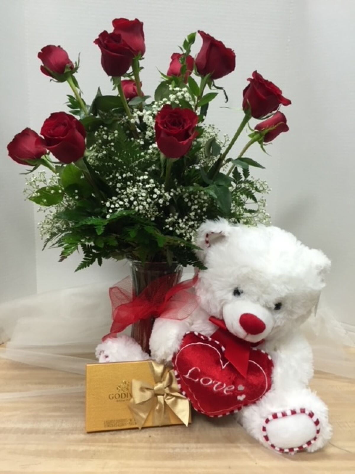 Red roses, chocolates and a teddy bear holding a heart are among the items Crystal Gardens Florist will be delivering.  