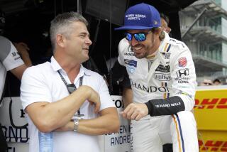 FILE - In this May 17, 2017, file photo, Gil de Ferran, left, talks with Fernando Alonso.