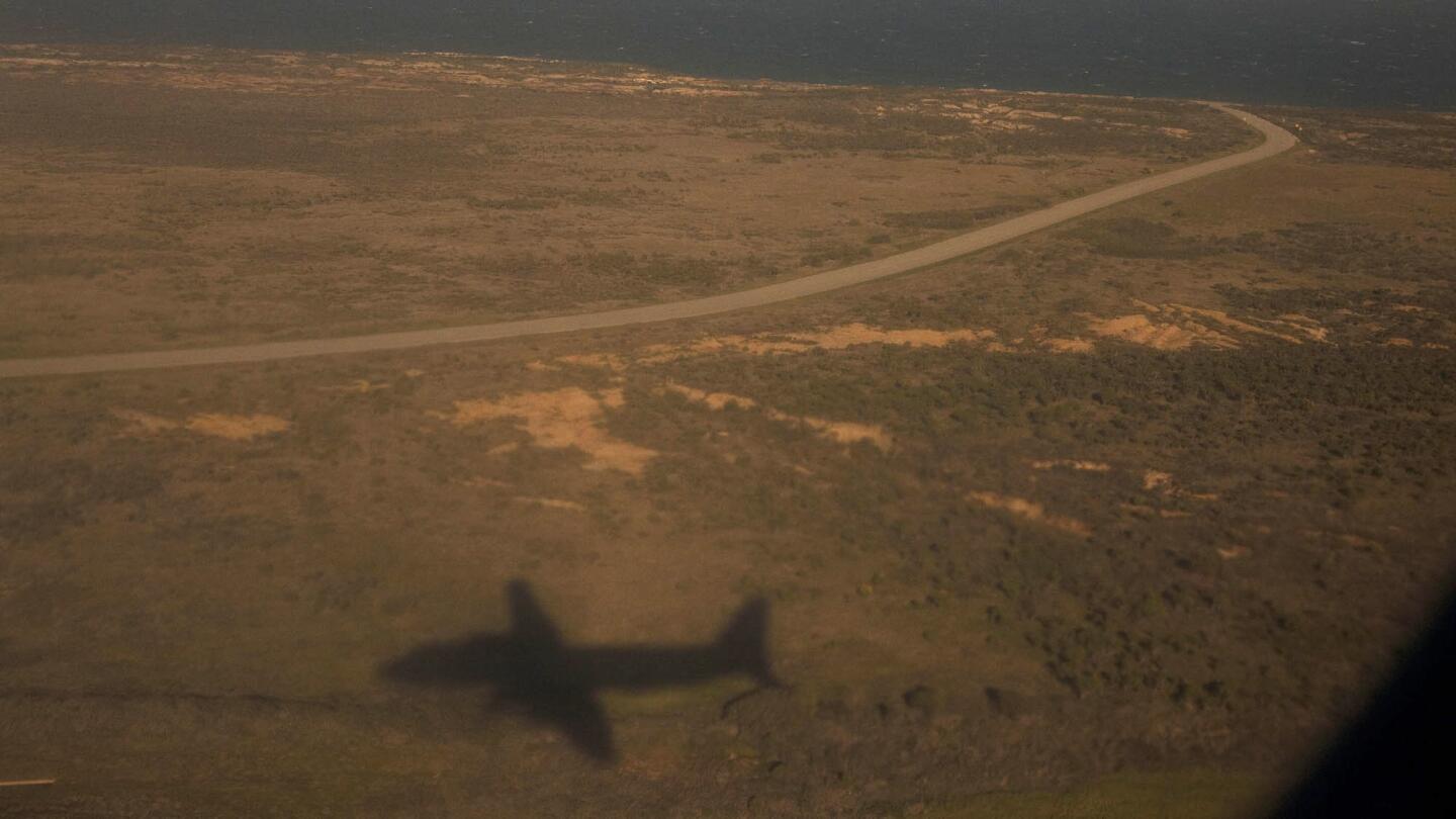 A plane flies over San Nicolas Island, the most remote of the Channel Islands.