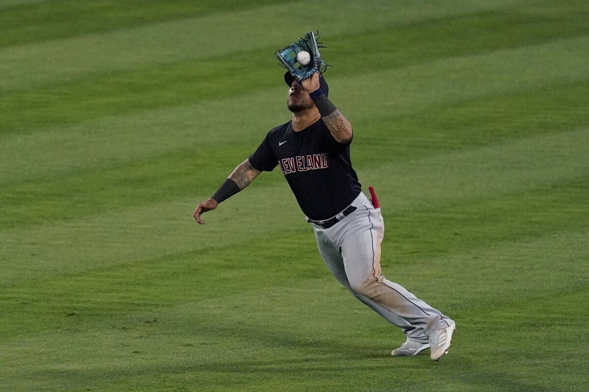 Cleveland Indians center fielder Harold Ramirez (40) catches a fly ball hit by Los Angeles Angels' Taylor Ward during the fifth inning of a baseball game Tuesday, May 18, 2021, in Anaheim, Calif. (AP Photo/Ashley Landis)