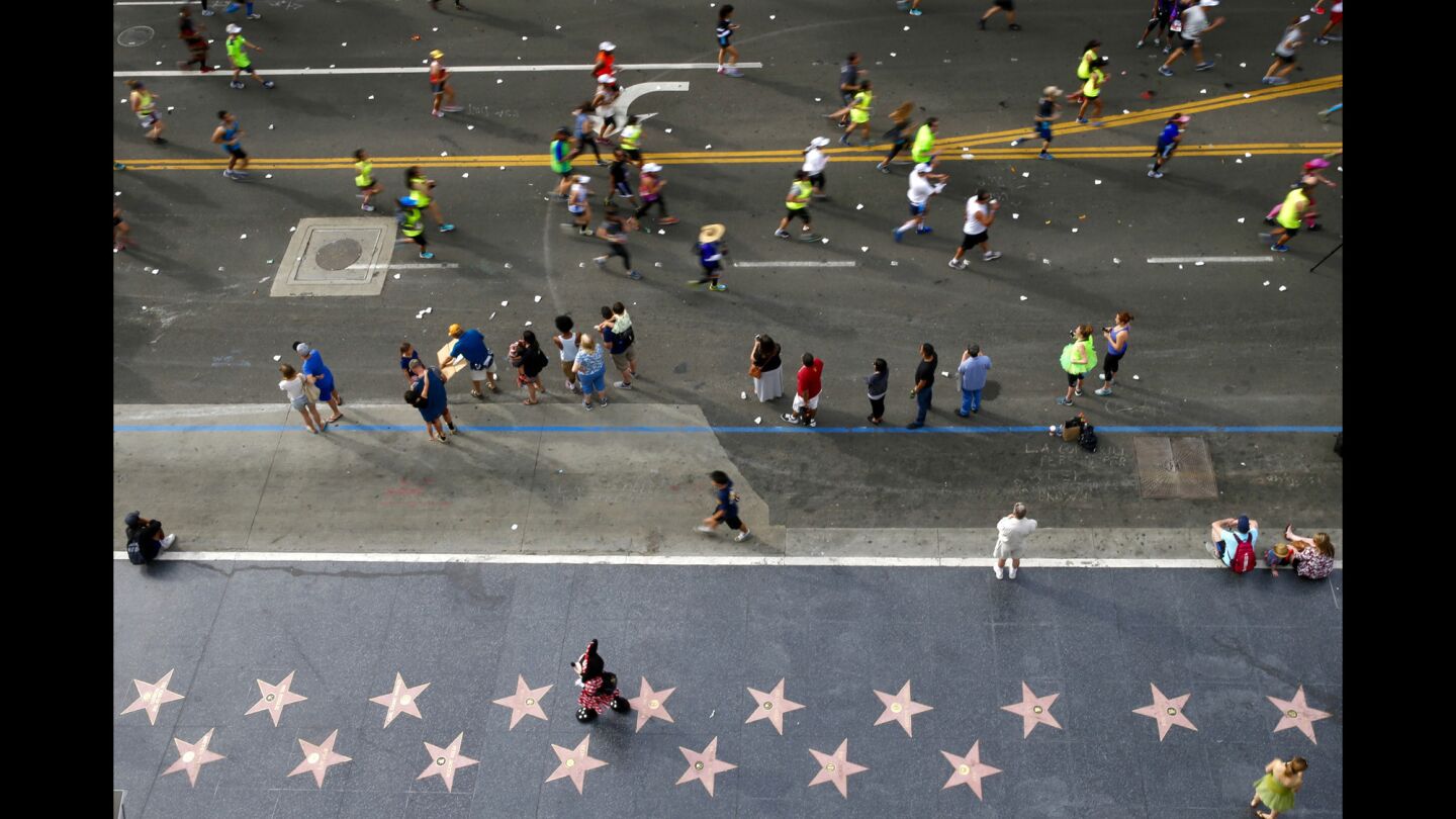 Runners along Hollywood Blvd. during the 30th Los Angeles Marathon on Sunday.