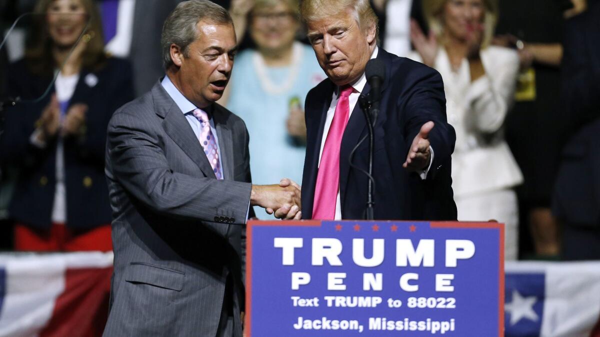 Republican Presidential nominee Donald Trump, right, invites Nigel Farage to speak during a campaign rally at the Mississippi Coliseum on August 24, 2016, in Jackson.