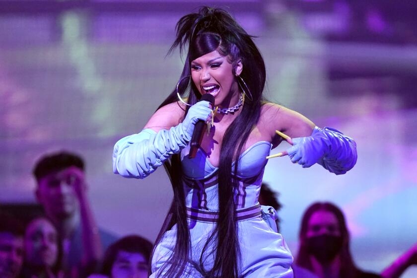 Cardi B performs "Tomorrow 2" at the American Music Awards on Sunday, Nov. 20, 2022, at the Microsoft Theater in Los Angeles. (AP Photo/Chris Pizzello)