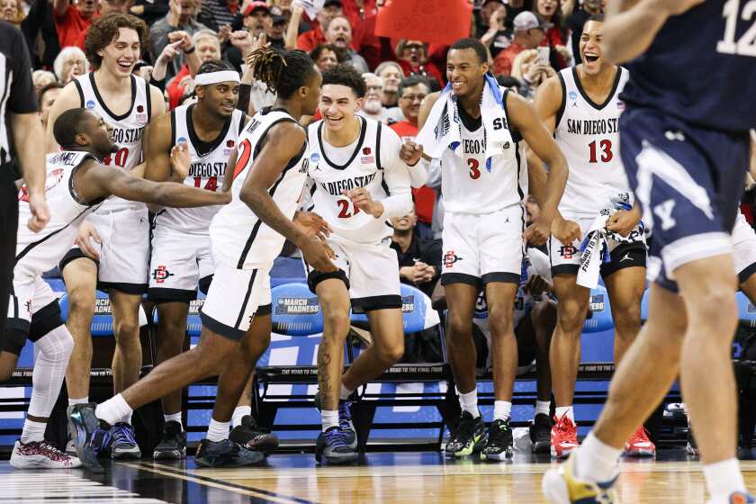 Spokane, WA - March 24: San Diego State players celebrate guard BJ Davis' (10) 3-pointer against Yale during the second round of the NCAA Tournament at Spokane Veterans Memorial Arena on Sunday, March 24, 2024 in Spokane, WA. (Meg McLaughlin / The San Diego Union-Tribune)