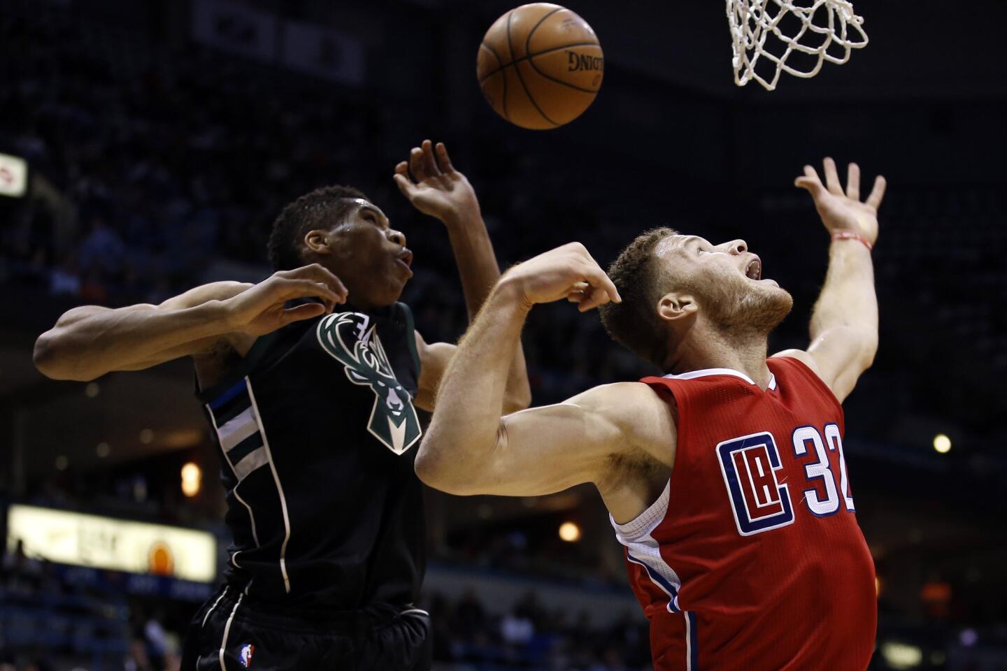 Los Angeles Clippers' Blake Griffin, left, and Milwaukee Bucks' Michael  Carter-Williams, right, run after a loose ball during the second half of an  NBA basketball game, Wednesday, Dec. 16, 2015, in Los