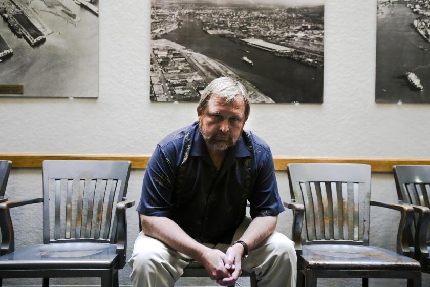 Leal Sundet, an International Longshore and Warehouse Union official, sits in the hiring hall of Local 8, the organization's Portland, Ore., chapter, in July 2012. Two weeks earlier, a federal judge had issued a restraining order meant to end a slowdown by the ILWU for control of two dockside jobs. On Nov. 4 of this year, the union was hit with a $94 million jury award stemming from the case, which may push it to file for bankruptcy protection.