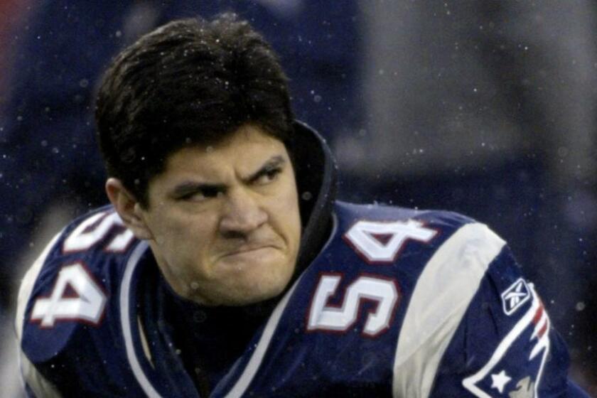 ** FILE ** New Enngland Patriots linebacker Tedy Bruschi stretches before their AFC divisional playoff game against the Indianapolis Colts at Gillette Stadium, in this Jan. 16, 2005 photo, in Foxboro, Mass. Bruschi was admitted to Massachusetts General Hospital in Boston on Wednesday after complaining of headaches. "He is in good condition and will be held for further evaluations," the team said in a statement. "The Bruschi family appreciates everyone's concern, but requests that you respect their privacy at this time." (AP Photo/Daniel P. Derella) ORG XMIT: NY173