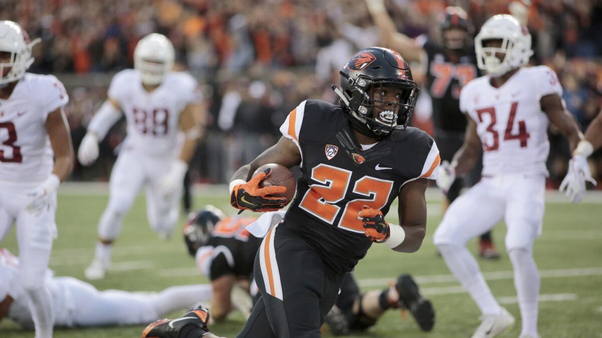 Oregon State running back Jermar Jefferson (22) breaks off a long run against Washington State.