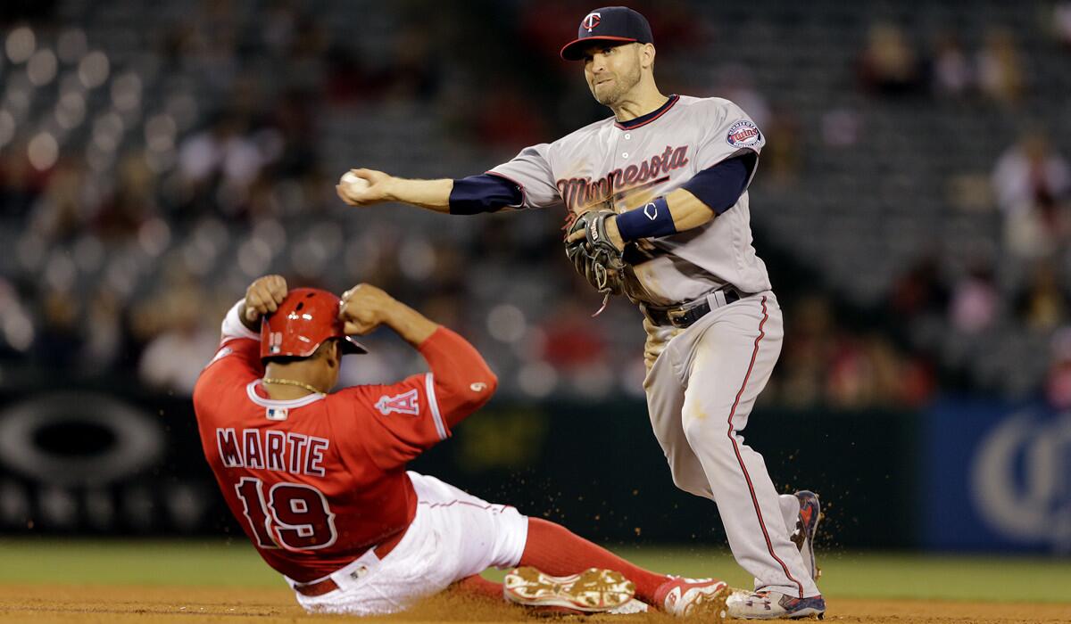 Minnesota Twins second baseman Brian Dozier, forcing out Angels third baseman Jefry Marte at second base, is a potential trade target for the Ddogers.