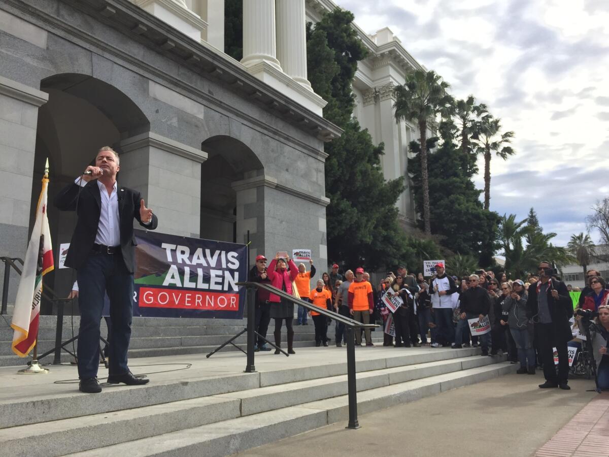 Republican candidate for governor Travis Allen praised President Trump during his rally on the steps of the state Capitol Sunday afternoon.