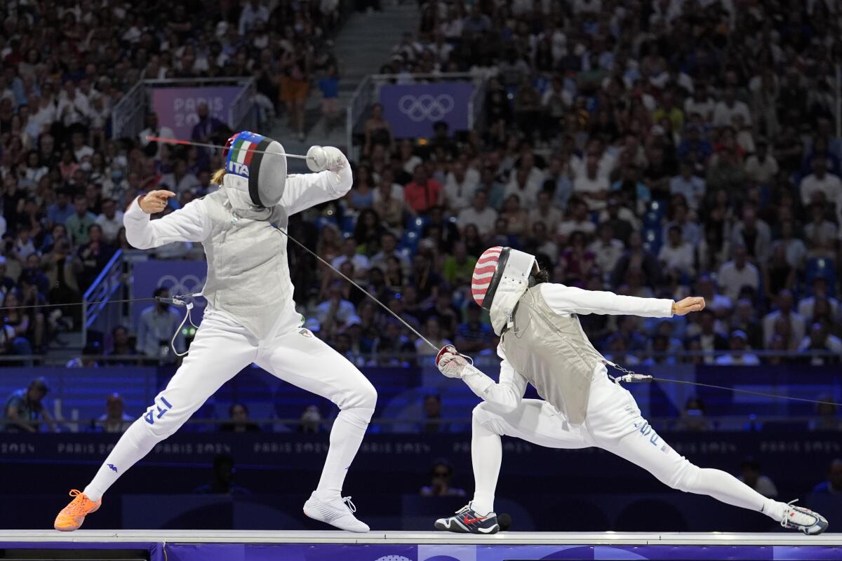 American Lee Kiefer lunges toward Italian Arianna Errigo during the 2024 Summer Olympics 