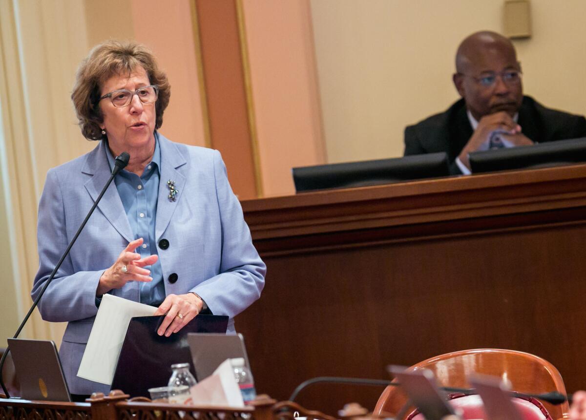 SACRAMENTO, CALIF. -- FRIDAY, SEPTEMBER 11, 2015: Senator Lois Wolk, left, makes her opening statement as the aid-in-dying legislation is introduced on the Senate floor, in Sacramento, Calif., on Sept. 11, 2015. (Marcus Yam / Los Angeles Times)