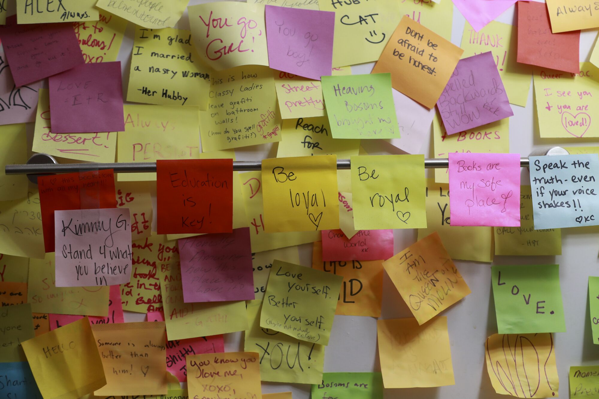A wall of multicolored sticky notes bearing various messages of encouragement.