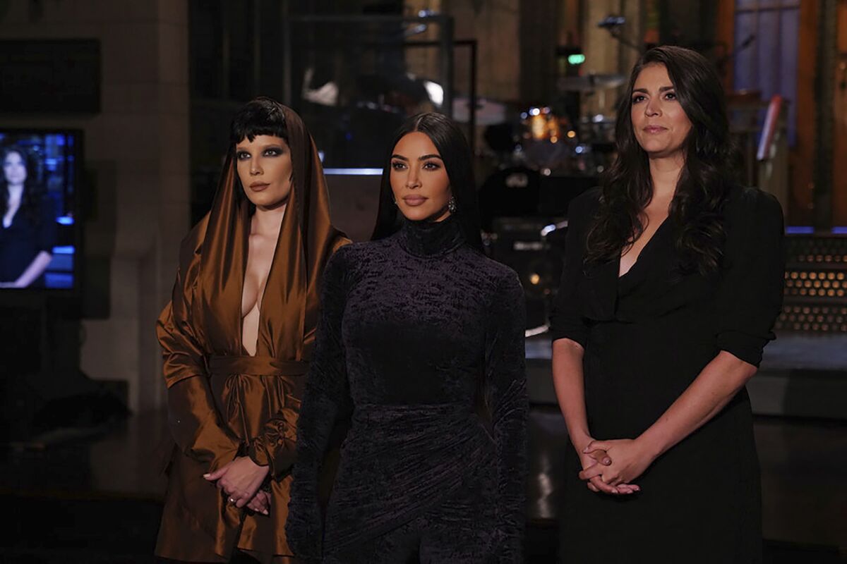 This image provided by NBC shows Episode 1807 musical guest Halsey, from left, host Kim Kardashian West, and Cecily Strong during promos for “Saturday Night Live” in Studio 8H on Thursday, Oct. 7, 2021. (Rosalind O'Connor/NBC via AP)