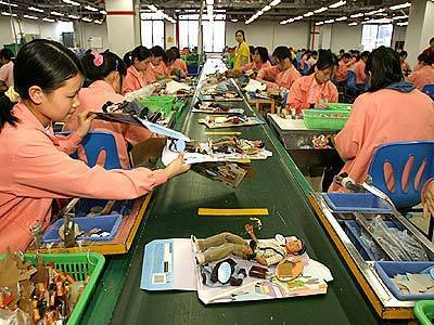 Chinese workers assemble various dolls of the 'Barbie' division shown on the assembly line at the Mattel (H.K.) Ltd. plant in Guanyao, China.