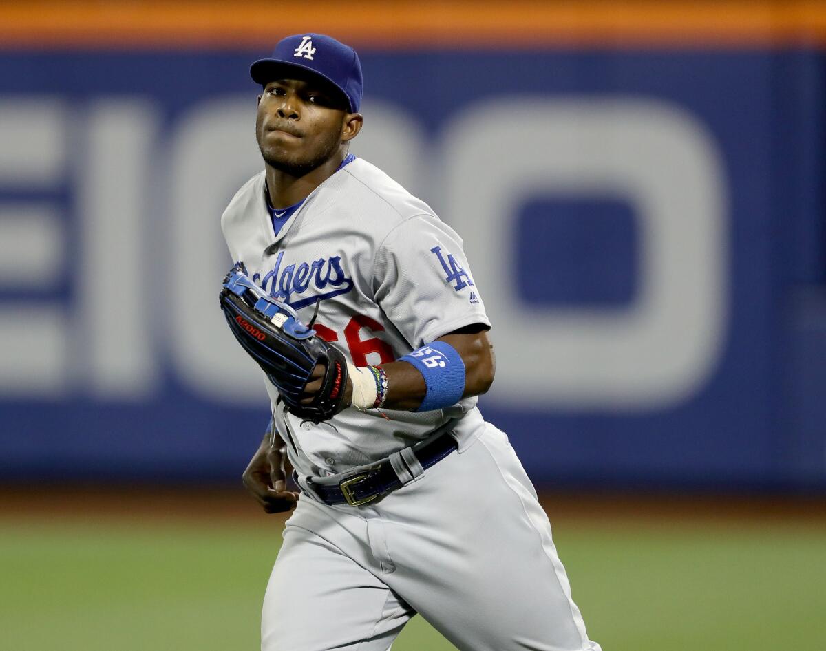 Dodgers outfielder Yasiel Puig (66) makes the catch for the final out against the Mets.