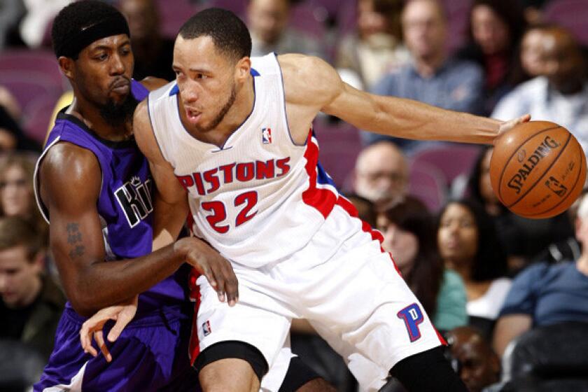 Pistons forward Tayshaun Prince, right, works in the post against Kings guard John Salmons.