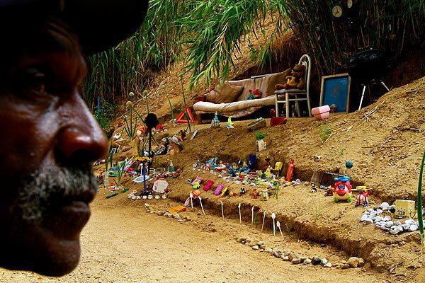 Charles Ray Walker, who began collecting discarded toys in 1993, said Christmas is the best time to find them because people throw away old toys to make room for the new. He uses these toys to decorate his garden, pathways and stairs that he has carved in the bamboo clearing.