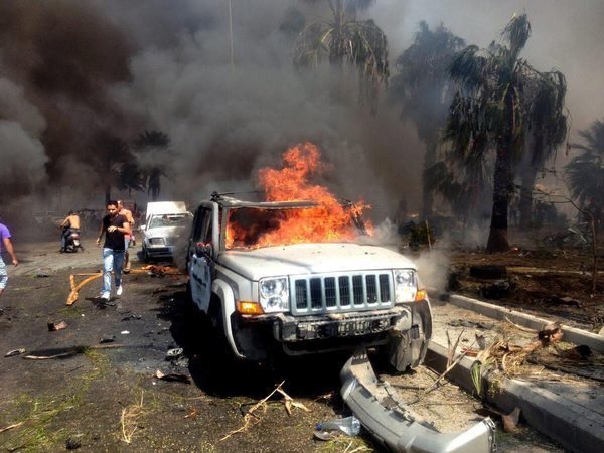 A vehicle burns at the site of an explosion in the northern Lebanese city of Tripoli.